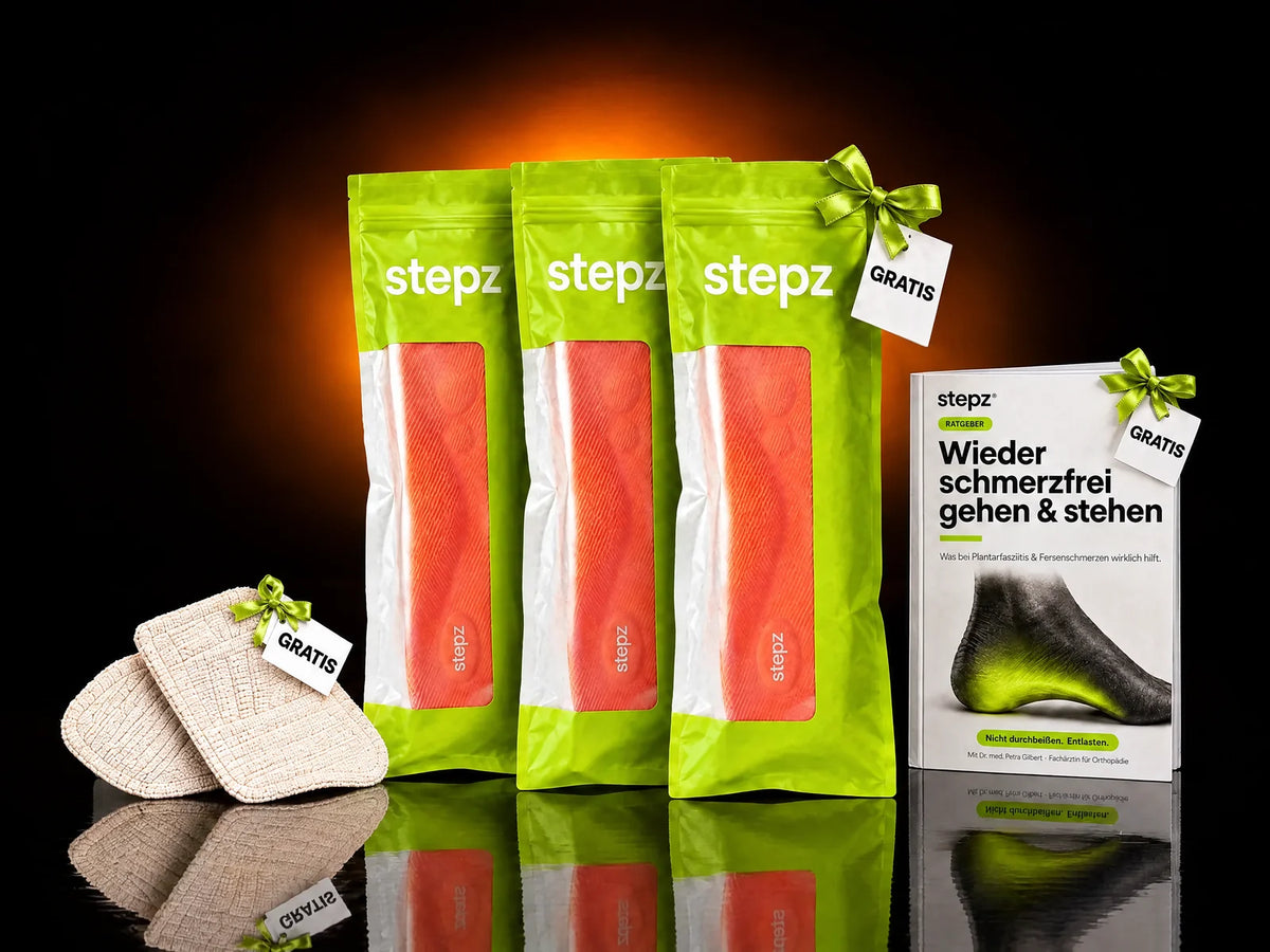 2+1-Paket: drei Paar stepz Entlastungssohlen, das Gratis-Paar mit Schleife, dazu Fersenpolster und Ratgeber mit GRATIS-Schildern